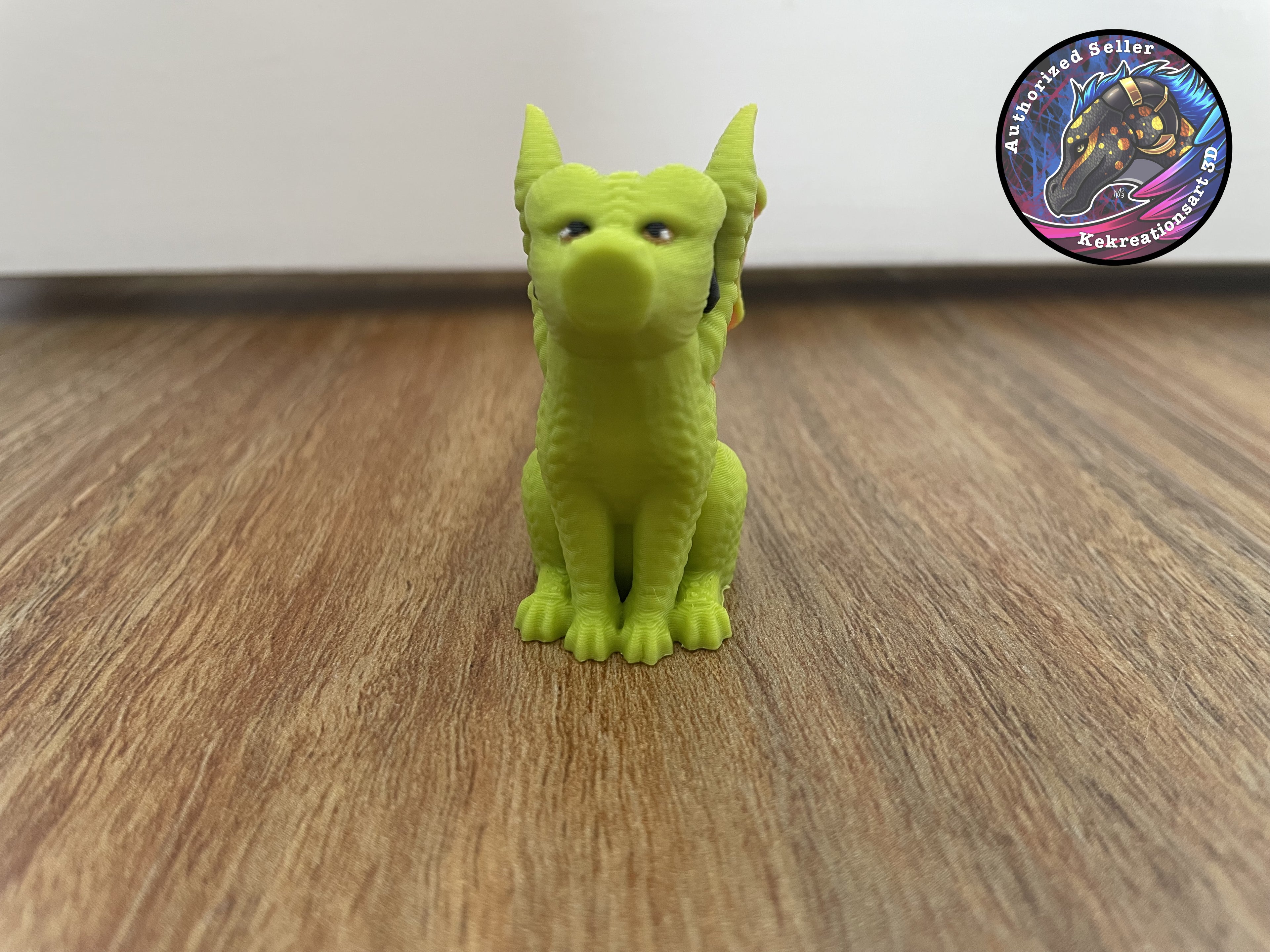 Green dragon figurine on a wooden floor